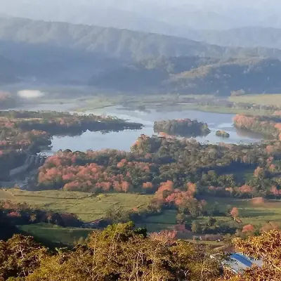 an aerial view of a lake in the fall at Pochotel in Turrialba