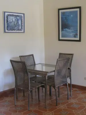 a dining room table with four chairs around it at Villa Vista Verde Ground Floor Home, Save Hundreds on your trip, Reduced Prices on Tours in Quepos