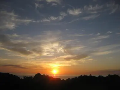 a sunset with the sun setting over the ocean at Villa Vista Verde Ground Floor Home, Save Hundreds on your trip, Reduced Prices on Tours in Quepos