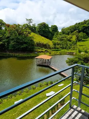 a dock in the middle of a lake at Burbi Lake Lodge Monteverde in Monteverde Costa Rica