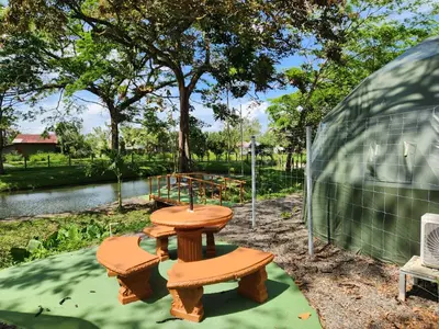 a picnic table and two benches next to a playground at Cabaña del Lago in Cuatro Esquinas