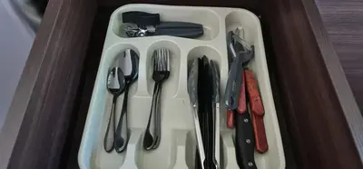 a plastic tray with utensils on a table at Hotel Green Jacó in Jacó