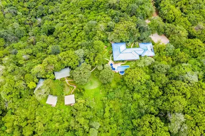 an aerial view of a house in the forest at Boutique Hotel Luna Azul in Playa Ostional