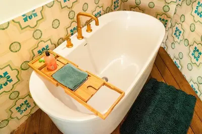 a bathroom with a bath tub with a toy at Designer Penthouse - Bougainvillea - Reserva Conchal Golf Resortl in Playa Conchal