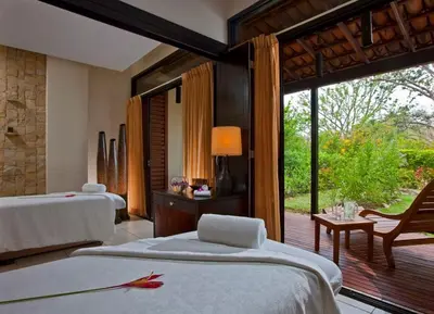 a hotel room with two beds and a patio at Designer Penthouse - Bougainvillea - Reserva Conchal Golf Resortl in Playa Conchal