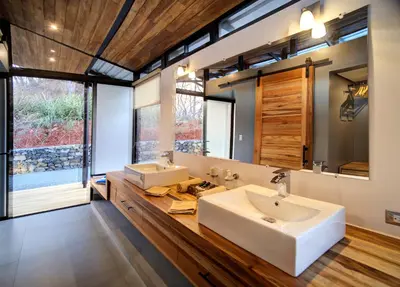 a bathroom with two sinks and a large mirror at Pacific Kalokairi - Adults Only in Tamarindo
