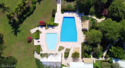 an aerial view of a house with a swimming pool at OPacifico Hotel Boutique in Playa Naranjo