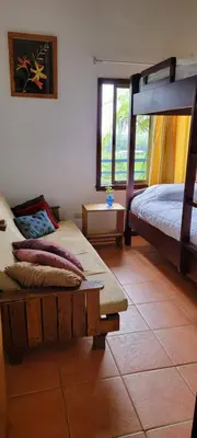 a bedroom with two bunk beds and a tiled floor at Volcano Panoramic Views in Vara Blanca