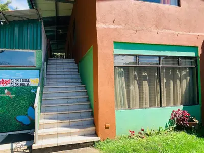 a set of stairs leading up to a building at Globi Lodge #4 in Monteverde Costa Rica