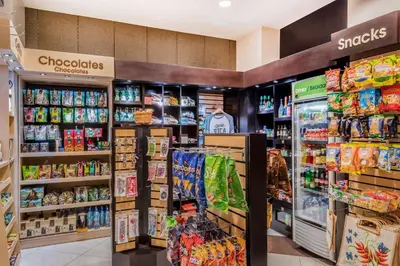 a grocery store aisle with food and drinks at Wyndham Garden San Jose Escazu, Costa Rica in San José