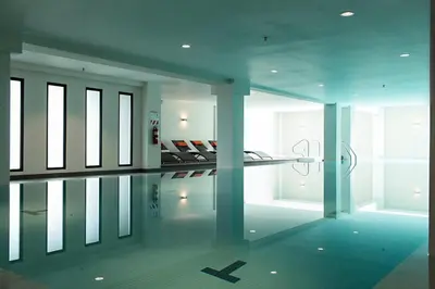 a room with a pool in the middle of a building at Wyndham Garden San Jose Escazu, Costa Rica in San José