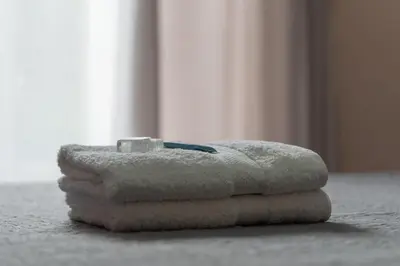 a pile of towels sitting on the floor at San Gabriel Apartments in Fortuna