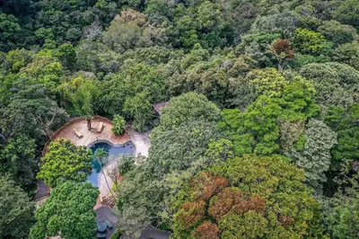 an aerial view of a bridge in the middle of a forest at Monteverde Lodge by Böëna in Monteverde Costa Rica