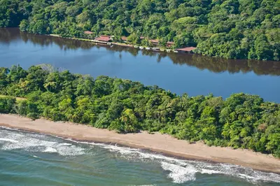 an aerial view of an island in a river at Tortuga Lodge in Tortuguero