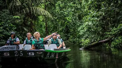 a group of people on a boat in the water at Tortuga Lodge in Tortuguero