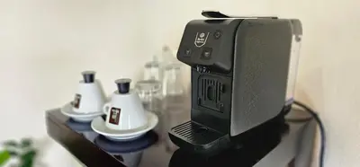 a black computer monitor on a wall with at Hotel Monte Real in Fortuna