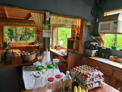 a kitchen with a table with bottles on it at Finca Terra Viva in Monteverde Costa Rica