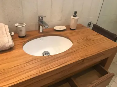 a wooden counter with a sink in a bathroom at Casa Papito in Potrero