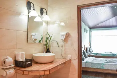 a bathroom with a sink and a mirror at Monteverde Ecolove in Monteverde Costa Rica