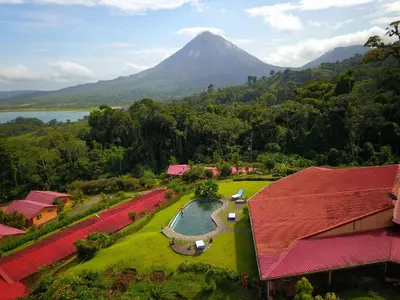 an aerial view of a resort with a mountain in the background at Hotel Nepenthe B&B in El Castillo de La Fortuna