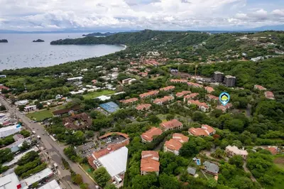 an aerial view of a city and the water at Renovated Condo in High-End Resort Community with Spectacular Mountain Views, Modern Design, and Beach Club Access in Coco
