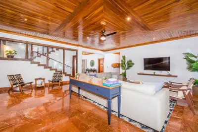 a living room with a couch and a table at Blue Jewel Oceanfront Private Villa in Tamarindo