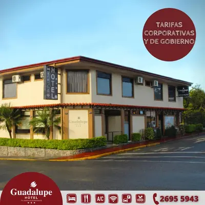 a building on the side of a street at Hotel Guadalupe in Tilarán