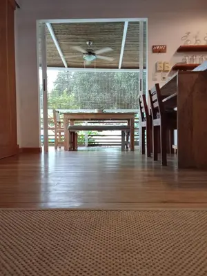 a dining room with a table and chairs at Casa SILURI UP in Santa Teresa Beach