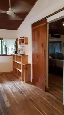 a room with a door to a bedroom with a bed at Casa SILURI UP in Santa Teresa Beach