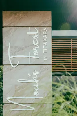 a sign for a building with the name of it at Noah's Forest by Tifakara in Fortuna