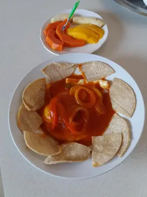 two plates of chips and salsa on a table at Eco Stay Hostel in San José