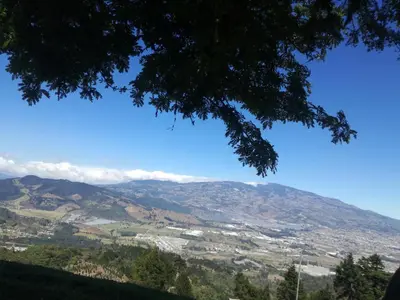 a view of the mountains from a tree at Hotel Vistas del Cielo in Cartago