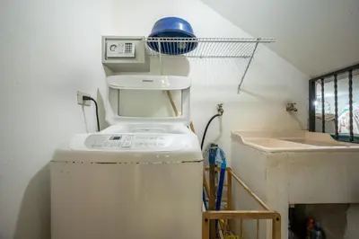 a kitchen with a mixer on top of a refrigerator at Casa Sol in Carrillo