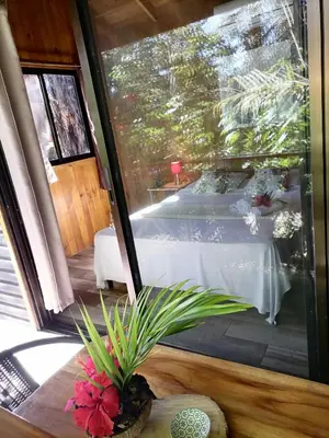 a view of a room with a table with a table at Casa el Colibrí in Parrita