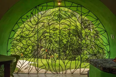 a green stained glass window with a lion on it at Green Moon Lodge in Montezuma