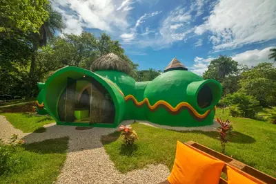 a small green house in the middle of a field at Green Moon Lodge in Montezuma