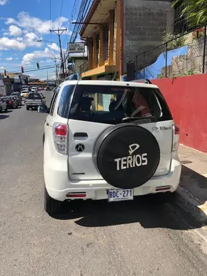a white car parked on the side of a street at #4 Private room close to Airport in Alajuela City