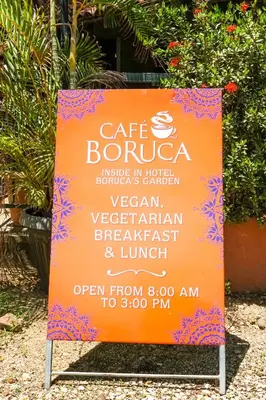 a sign for a cafe burrito restaurant at Hotel Boruca Tamarindo in Tamarindo