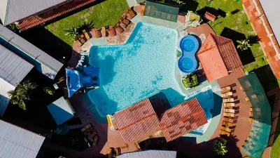 an overhead view of a swimming pool in a resort at Amapola Resort in Jacó