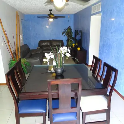 a dining room table with chairs and a couch at 3Rooms Amaizing Beach Studio in Jacó