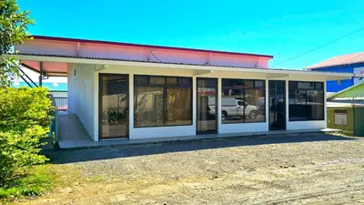 a building with a lot of windows on it at Cattleya Family in Monteverde Costa Rica