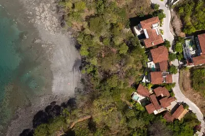 an overhead view of a house next to the water at Alouatta Guesthouse en Las Catalinas - Beachfront GUESTHOUSE for 6 people in Playa Danta