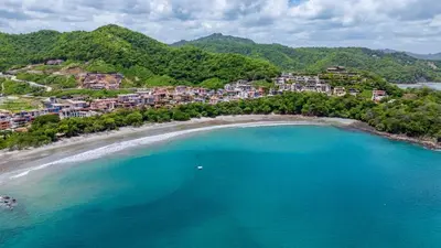 an aerial view of a beach in a resort at Alouatta Guesthouse en Las Catalinas - Beachfront GUESTHOUSE for 6 people in Playa Danta