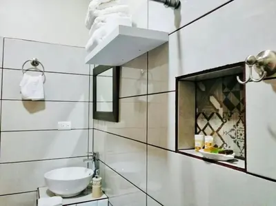 a bathroom with a sink and a toilet in it at Lisa Loft Boutique Apartment in Fortuna