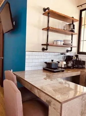 a kitchen with a counter top in a room at Lisa Loft Boutique Apartment in Fortuna