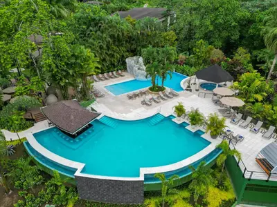 an overhead view of a swimming pool at a resort at Hotel Lomas del Volcan in Fortuna