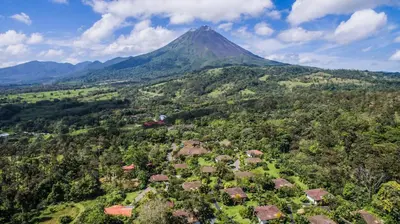 an aerial view of a mountain with houses and trees at Hotel Mountain Paradise in Fortuna