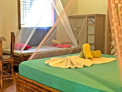 a bedroom with two bunk beds with stuffed animals on the bed at Cascada Verde Eco Lodge & Hostel in Uvita