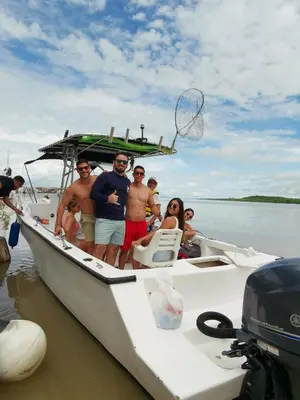 a group of people on a boat in the water at Puntarenas Bed & Coffee by Aldea in Puntarenas
