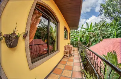 a balcony of a house with a window at Sol y Luna Apartments in Fortuna